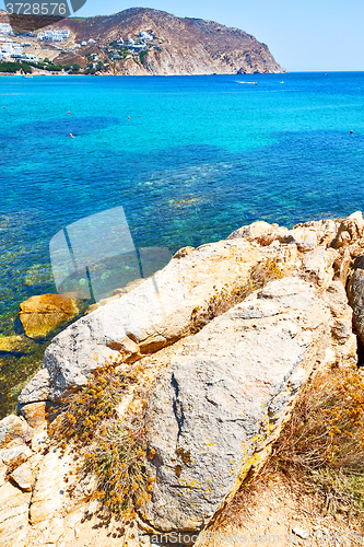 Image of in   the mykonos island rock sea and beach blue   sky