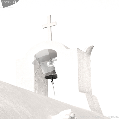 Image of cross  in santorini greece old construction and the sky
