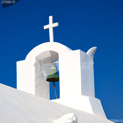 Image of cross  in santorini greece old construction and the sky