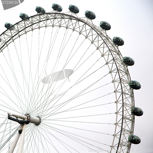 Image of london eye in the spring sky and white clouds