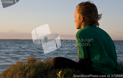 Image of boy looking over lake