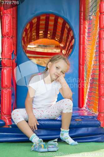 Image of Tired but happy three year old girl from the game soft room