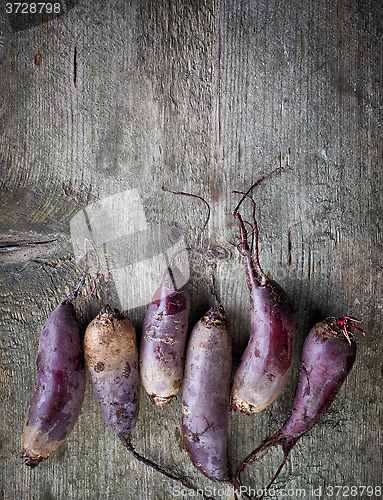 Image of Beet roots on wooden table