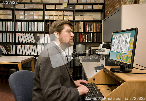 Image of Researcher searching a computer database archive