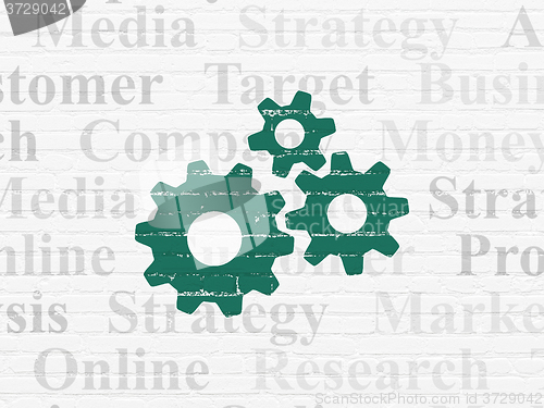 Image of Marketing concept: Gears on wall background