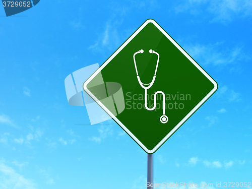 Image of Health concept: Stethoscope on road sign background