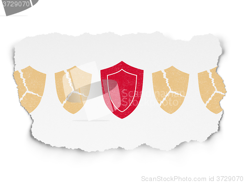 Image of Protection concept: shield icon on Torn Paper background