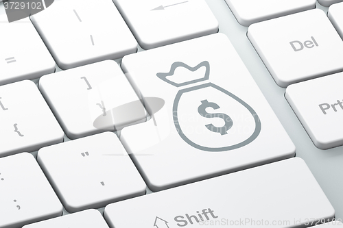 Image of Currency concept: Money Bag on computer keyboard background