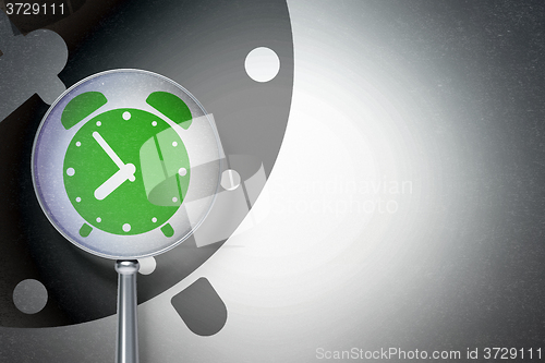 Image of Timeline concept:  Alarm Clock with optical glass on digital background