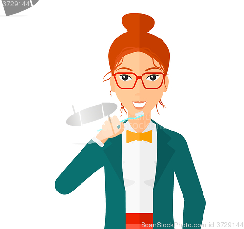 Image of Woman brushing teeth.