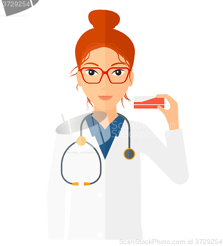 Image of Pharmacist showing some medecine.