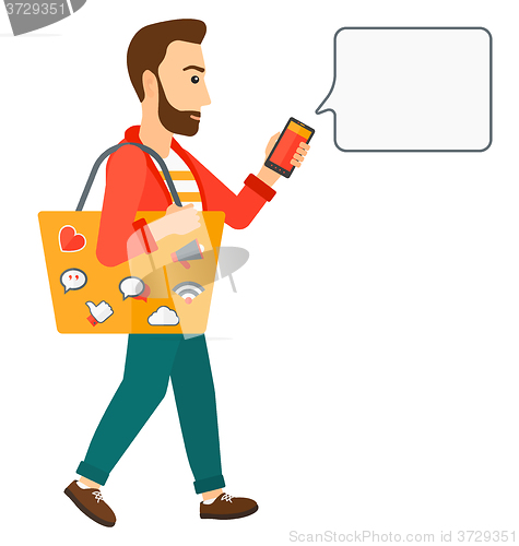 Image of Man walking with smartphone.