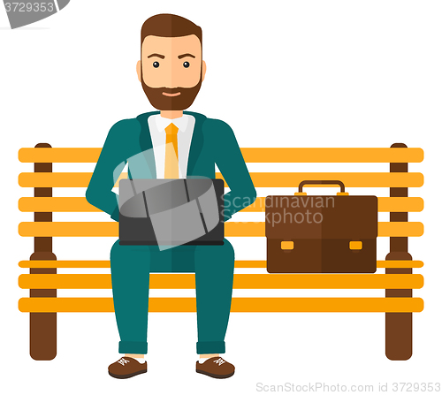 Image of Man working on laptop.