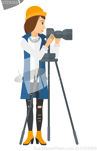Image of Photographer working with camera.