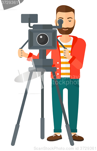 Image of Cameraman with movie camera.