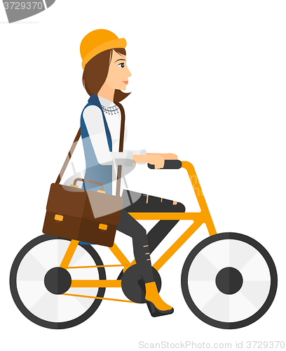 Image of Woman cycling to work.