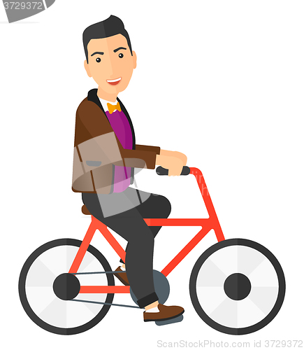 Image of Man riding bicycle.