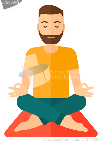 Image of Man meditating in lotus pose.