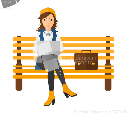 Image of Woman working on laptop.