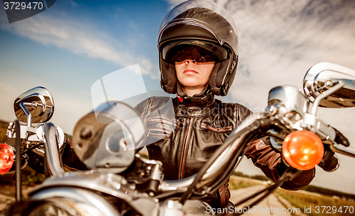 Image of Biker girl on a motorcycle