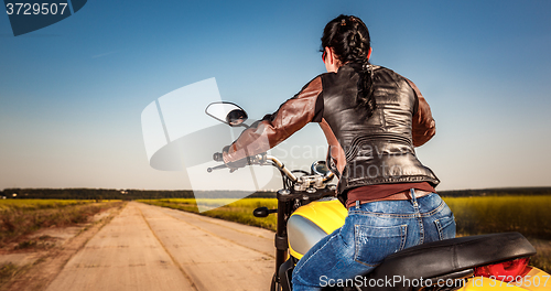 Image of Biker girl on a motorcycle