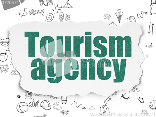 Image of Tourism concept: Tourism Agency on Torn Paper background