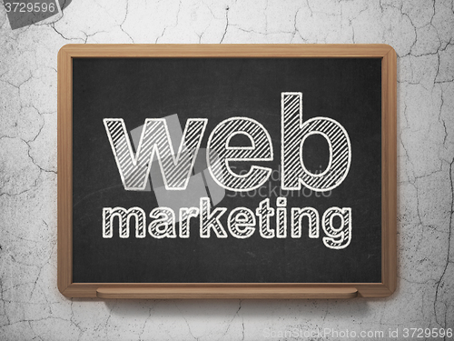 Image of Web development concept: Web Marketing on chalkboard background