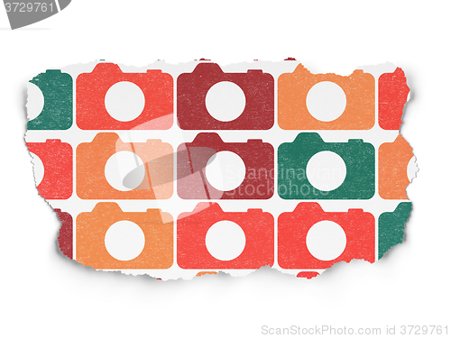 Image of Vacation concept: Photo Camera icons on Torn Paper background