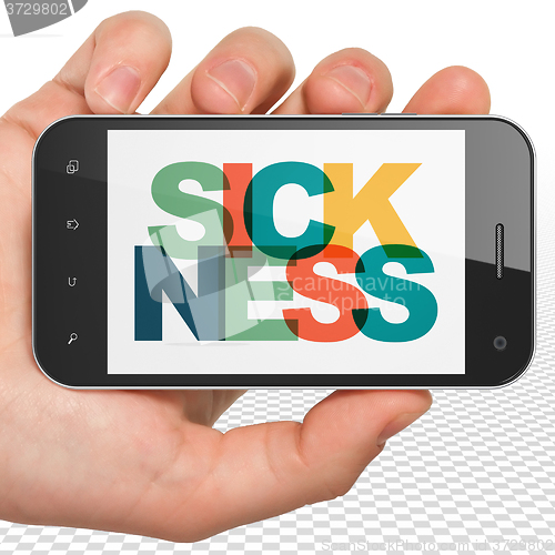 Image of Health concept: Hand Holding Smartphone with Sickness on  display