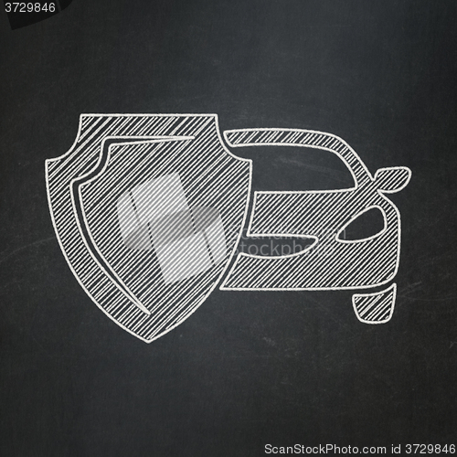 Image of Insurance concept: Car And Shield on chalkboard background
