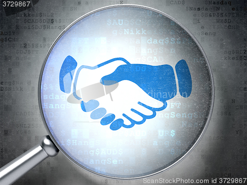 Image of Finance concept: Handshake with optical glass on digital background