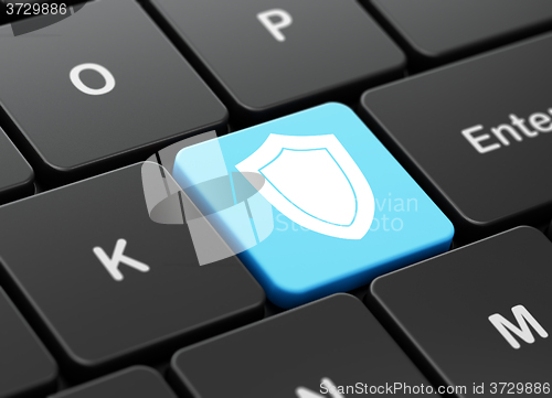 Image of Security concept: Shield on computer keyboard background