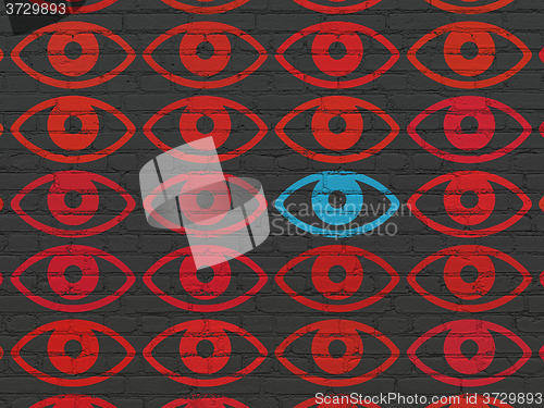 Image of Protection concept: eye icon on wall background