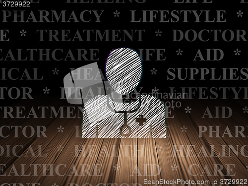 Image of Healthcare concept: Doctor in grunge dark room