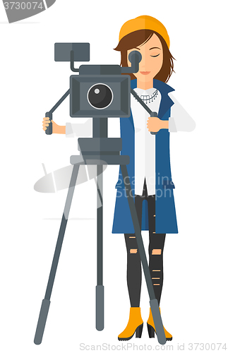 Image of Camerawoman with movie camera.