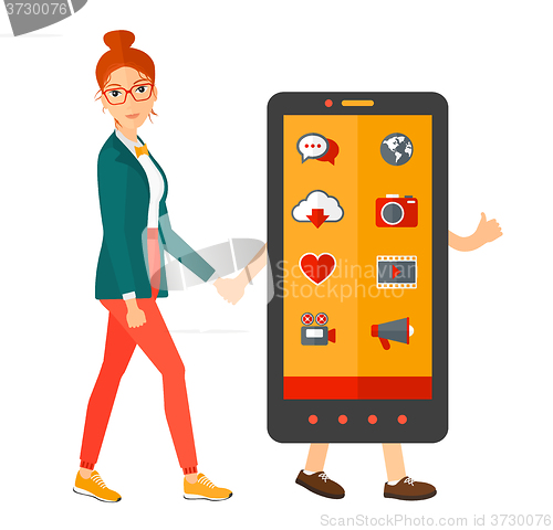 Image of Woman walking with smartphone.