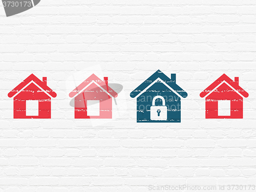 Image of Protection concept: home icon on wall background