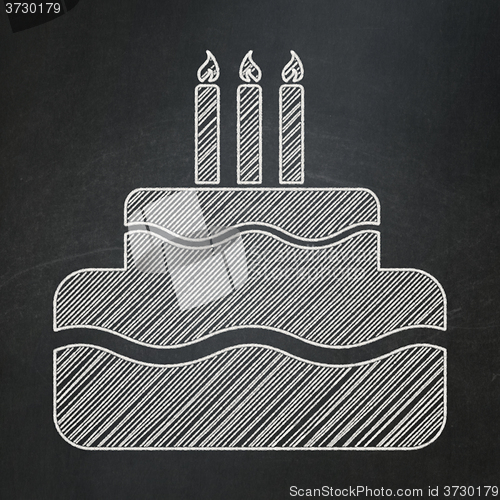 Image of Holiday concept: Cake on chalkboard background