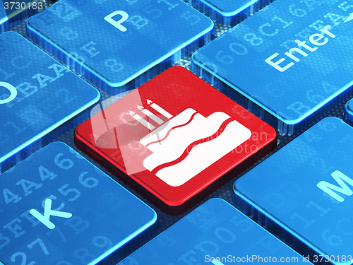 Image of Holiday concept: Cake on computer keyboard background