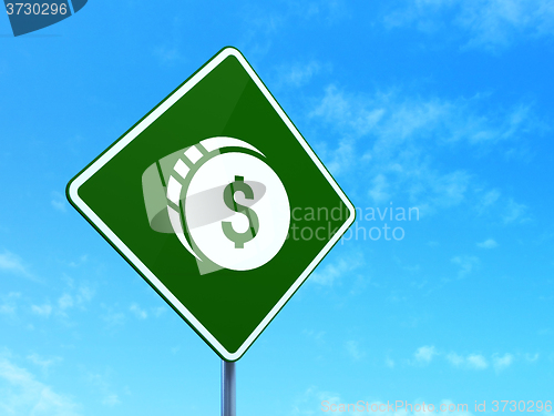 Image of Currency concept: Dollar Coin on road sign background