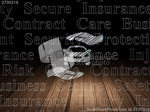 Image of Insurance concept: Car And Palm in grunge dark room