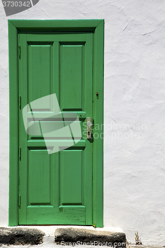 Image of spain  piece of colorated green wood as a 