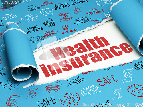 Image of Insurance concept: red text Health Insurance under the piece of  torn paper