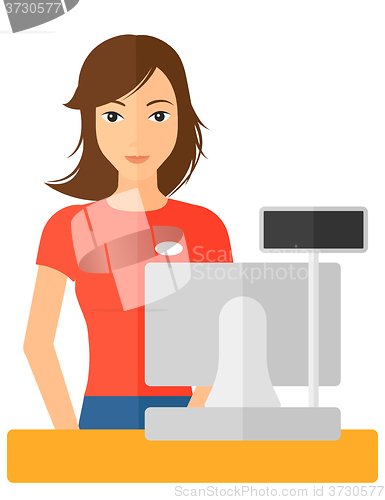 Image of Saleslady standing at checkout.