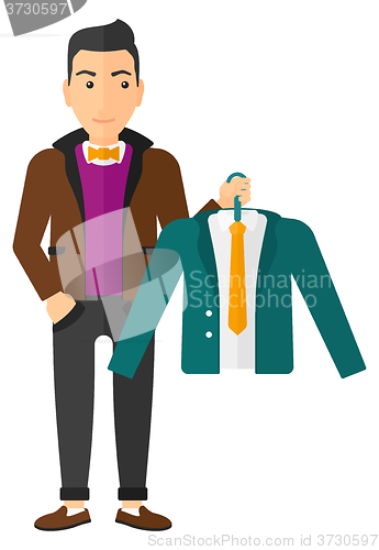 Image of Man holding jacket.