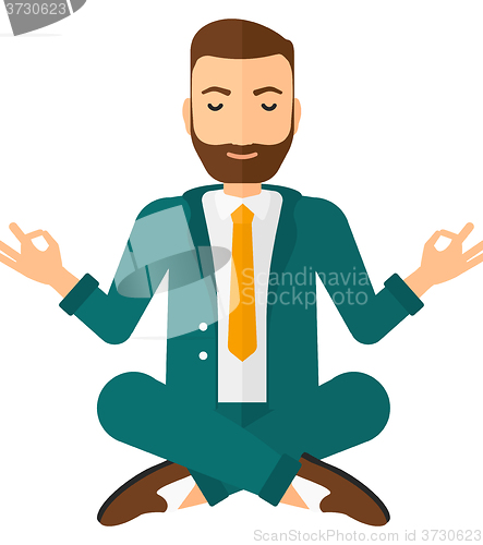 Image of Businessman meditating in lotus pose.