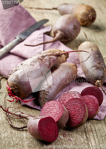 Image of Beet roots on wooden table