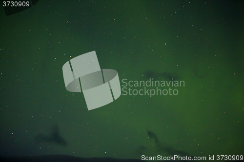 Image of Northern lights with bright stars in Iceland