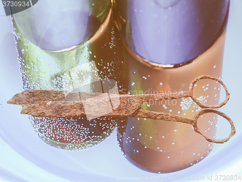 Image of  Rusted scissors and bottles vintage