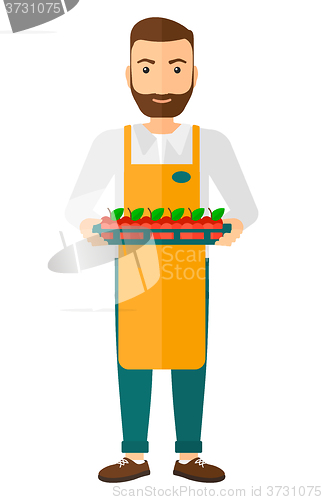 Image of Smiling supermarket worker.